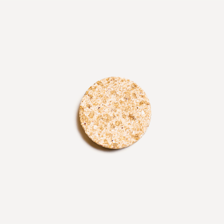Close-up of Spirited Paw Health + Vitality chewable wafer texture on a white background.