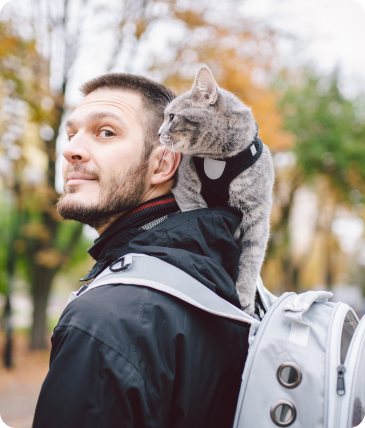 man with cat on shoulders
